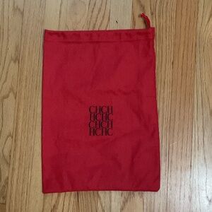 Carolina Herrera red dust bag draw string with the signature CH logo